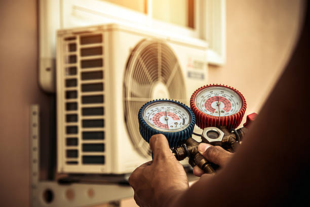 Professional Air Conditioning Service technician working in Greenback, TN